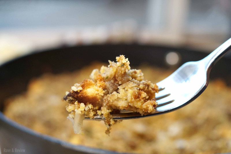 Cornbread stuffing with sausage on fork